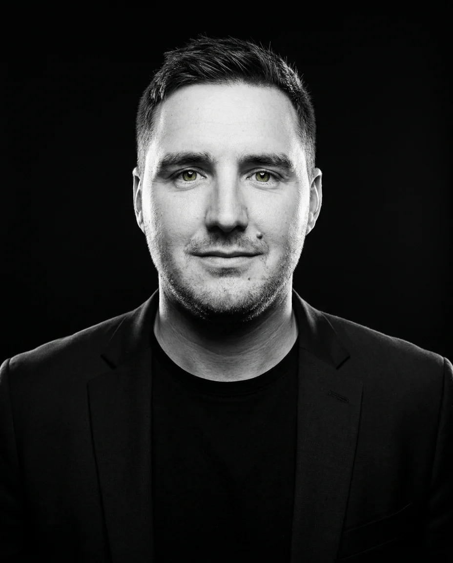 Daniel in a black blazer, studio portrait